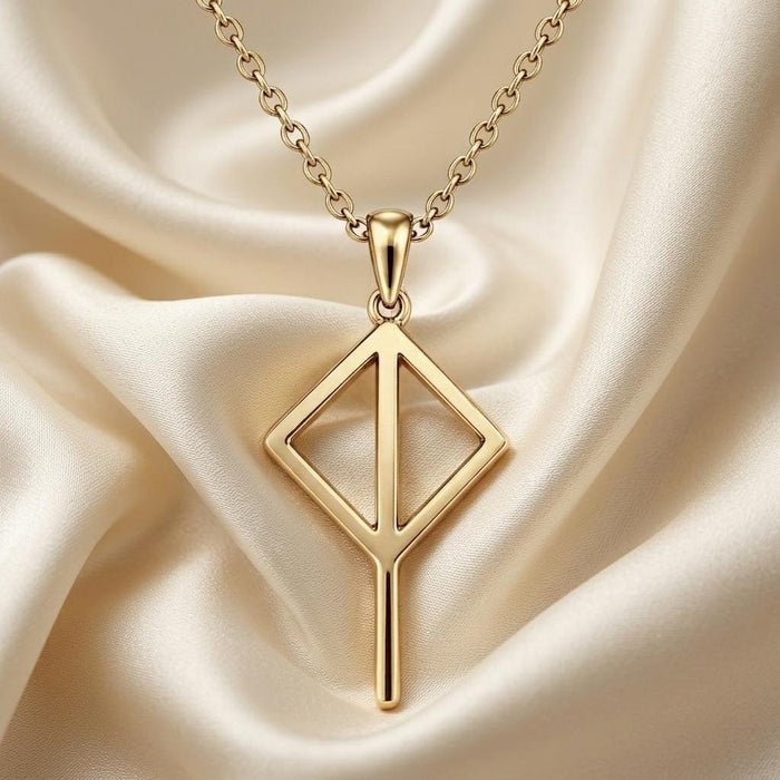 Gold Plated Silver Viking Balance Rune pendant with an open diamond frame on cream satin