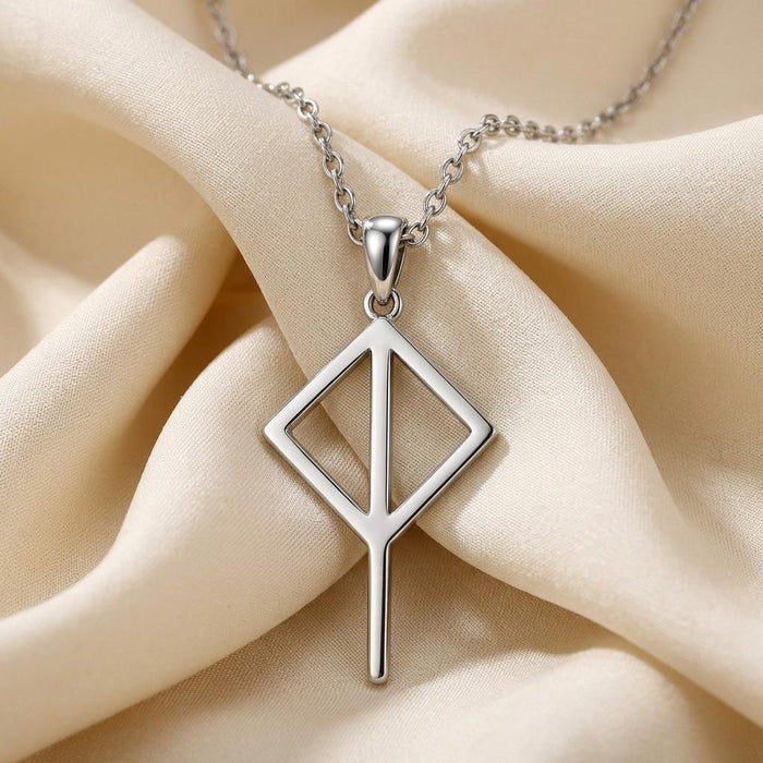 Silver Viking Balance Rune Necklace with an open diamond pendant on cream satin
