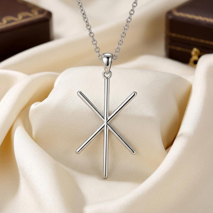 Silver Viking Strength Bind Rune pendant necklace displayed on ivory satin