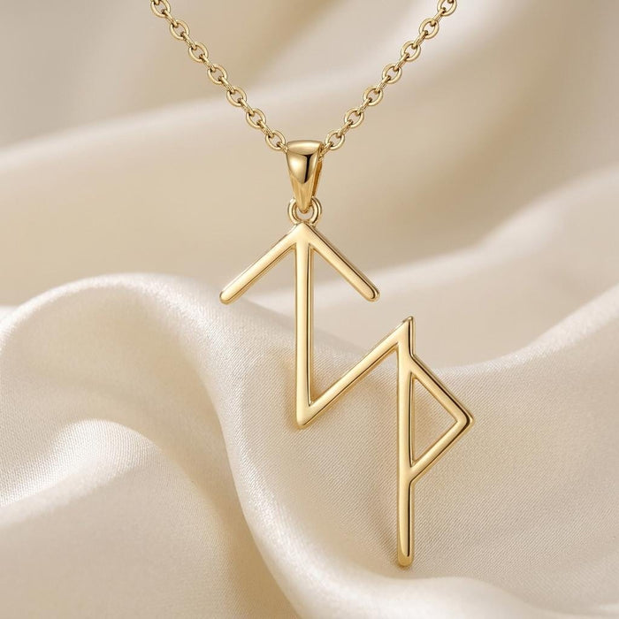Gold Plated Silver Viking Success rune pendant and chain on cream satin